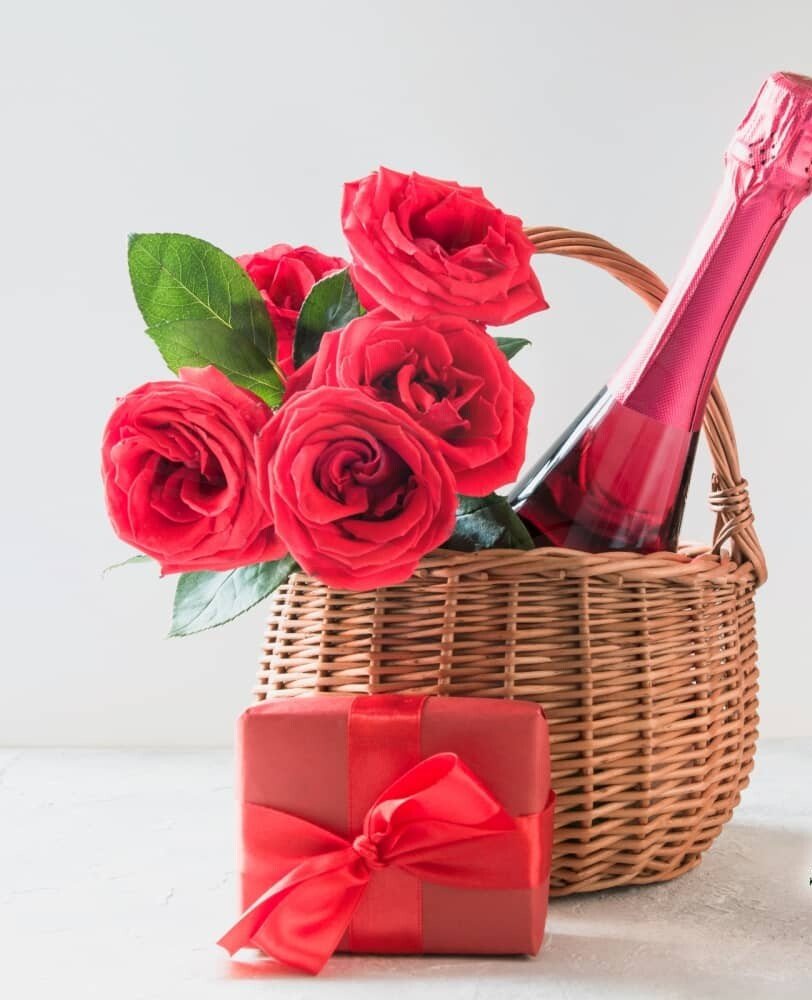 Basket of Red Roses with Red Wine and chocolates
